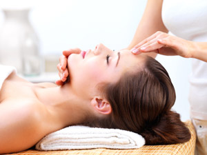 Image of woman receiving a customized facial at theSANCTUARY Spa in Salem, NH.